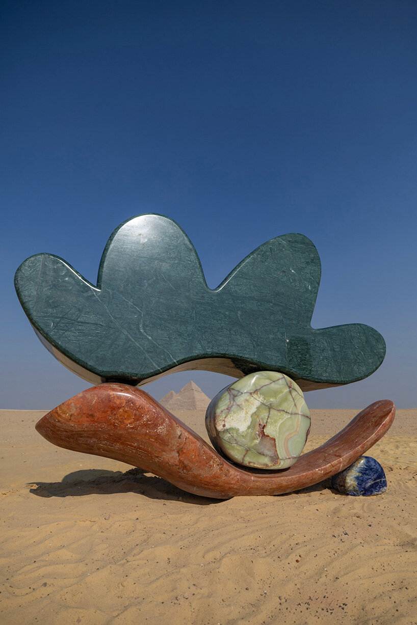 the reinterpretation of the Eye of Horus finds its form in a deep green marble arc
