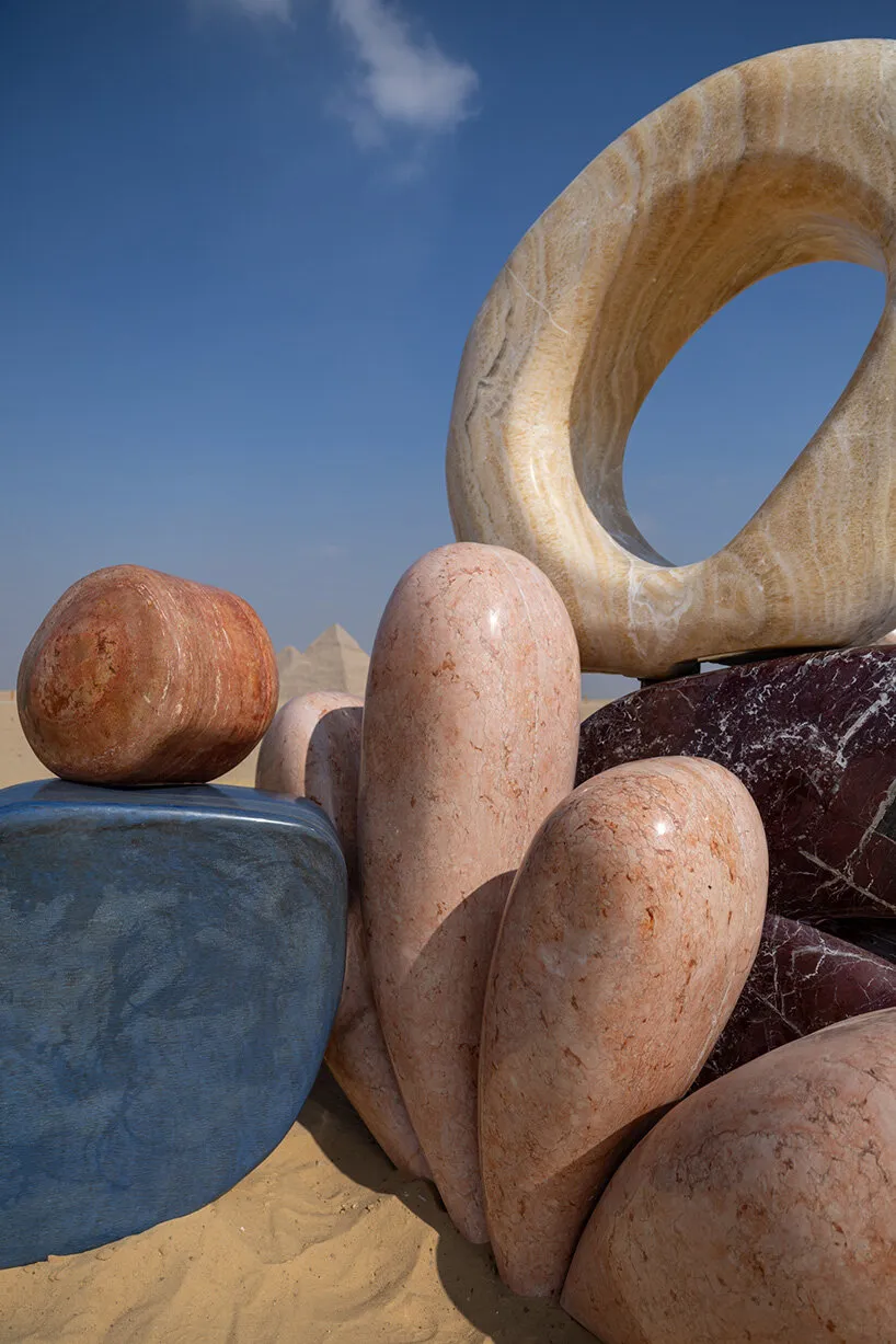 the installation transforms the artist’s signature organic forms into geological mass
